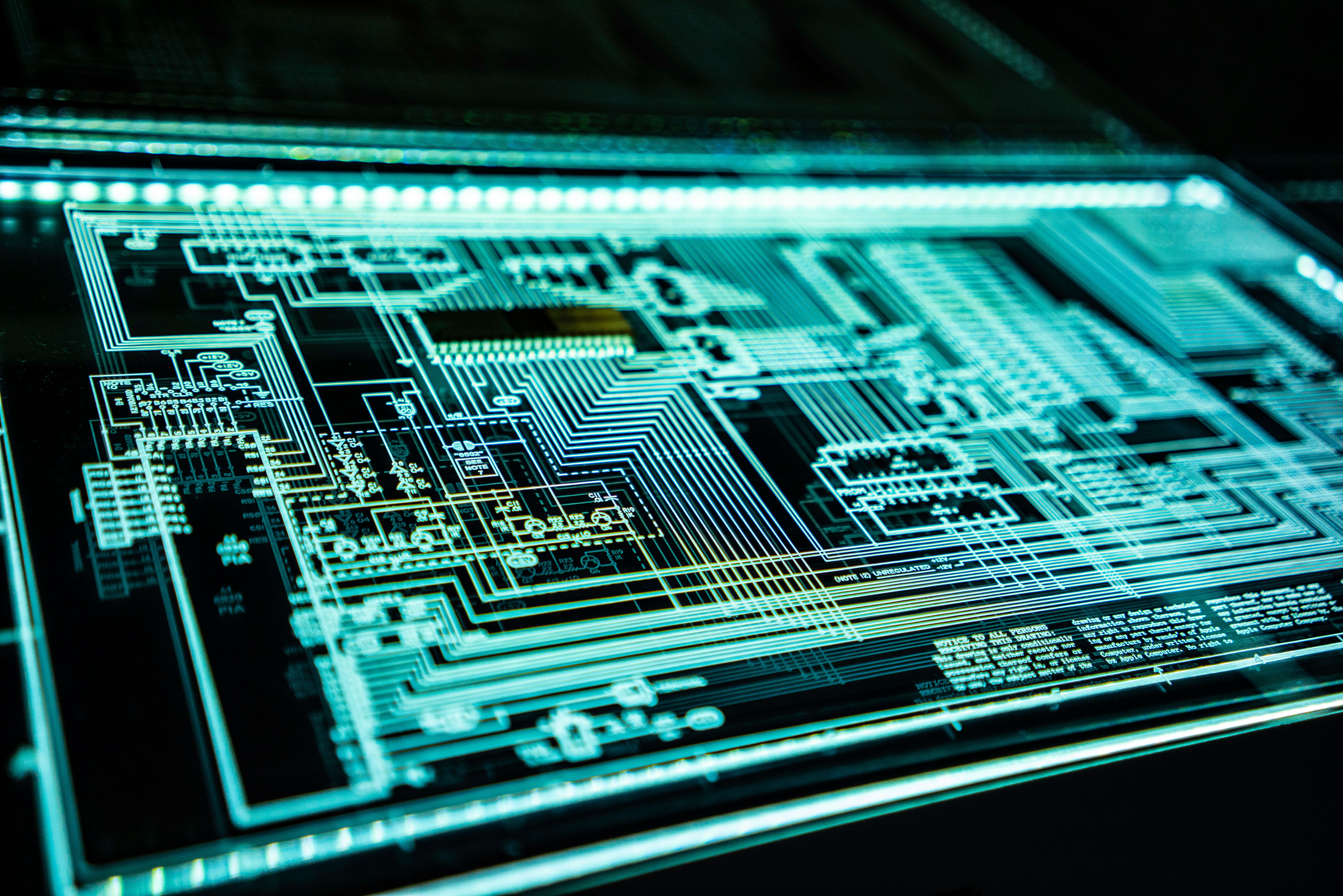 Circuit board illuminated in cyan light